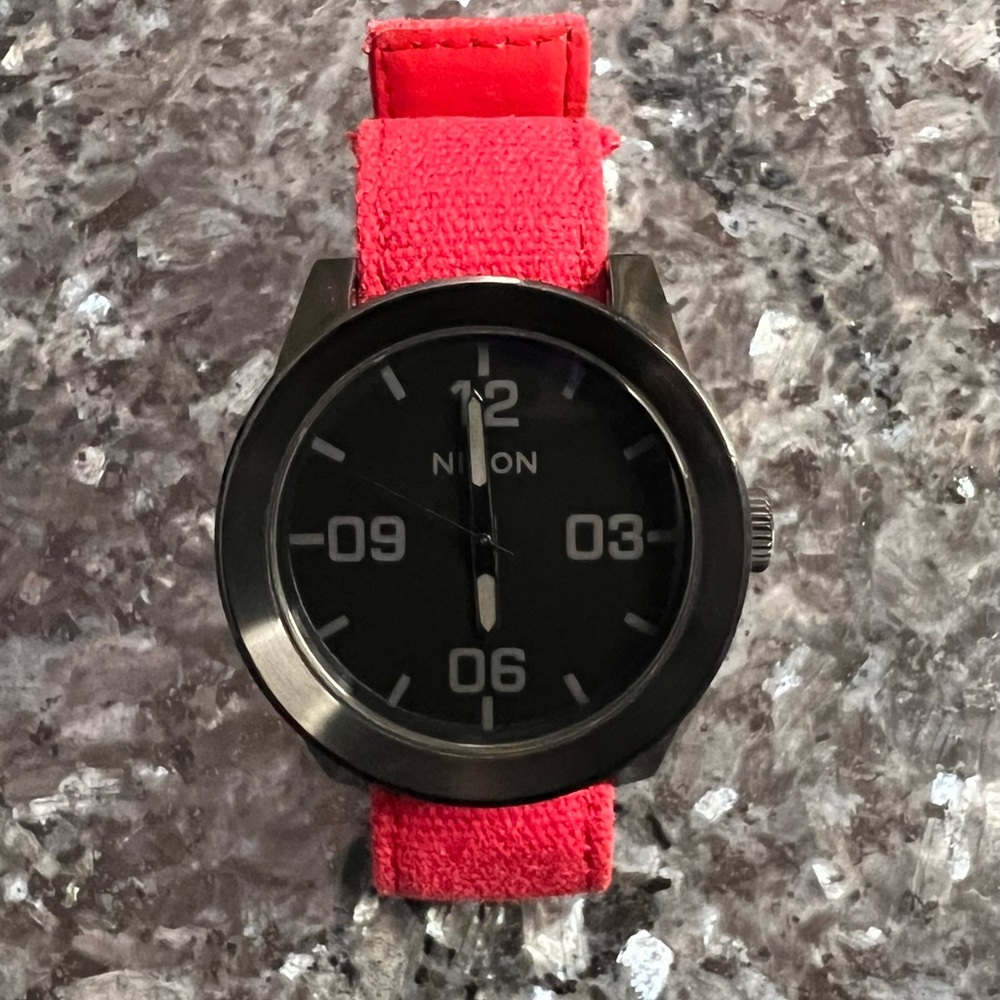 Nixon Black Dial Watch with Vibrant Red Strap